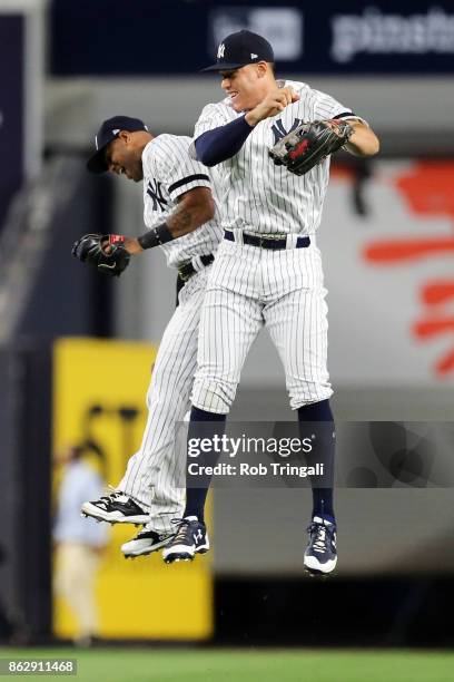 Aaron Judge and Aaron Hicks of the New York Yankees celebrate after Game 5 of the American League Championship Series against the Houston Astros at...