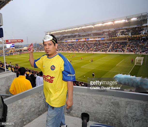 Soccer fan wears protective masks during a match between the Chicago Fire and Club America from Mexico at Toyota Park at April 29, 2009 in...