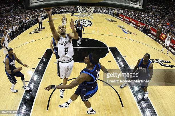 Guard Tony Parker of the San Antonio Spurs takes a shot against Josh Howard of the Dallas Mavericks in Game Five of the Western Conference...