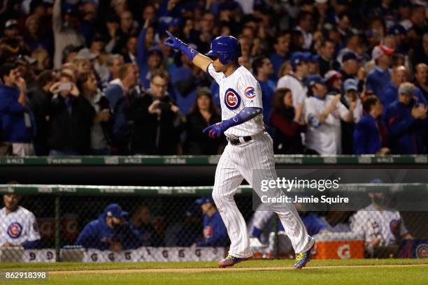 Willson Contreras of the Chicago Cubs celebrates as he rounds the bases after hitting a home run in the second inning against the Los Angeles Dodgers...