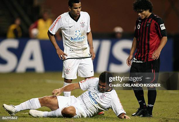 Brazilian soccer player Ronaldo of Corintians reacts after colliding with Marcelo Azevedo of Atletico Paranaense during a match valid for Brazil's...