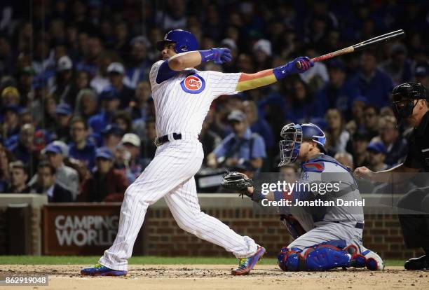 Willson Contreras of the Chicago Cubs hits a home run in the second inning against the Los Angeles Dodgers during game four of the National League...