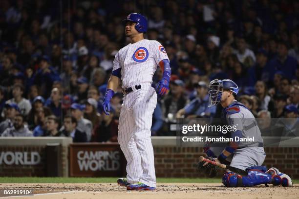 Willson Contreras of the Chicago Cubs reacts to hitting a home run in the second inning against the Los Angeles Dodgers during game four of the...