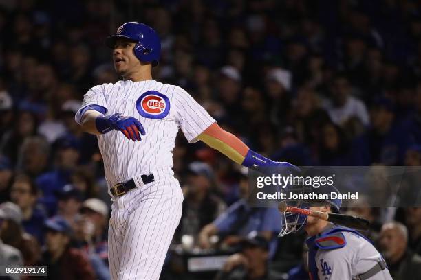 Willson Contreras of the Chicago Cubs hits a home run in the second inning against the Los Angeles Dodgers during game four of the National League...