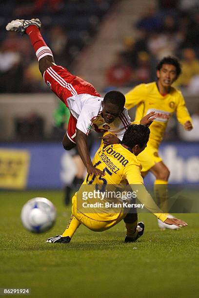 Patrick Nyarko of the Chicago Fire collides with Ademar Rodriguez of Club America during the first half at Toyota Park on April 29, 2009 in...
