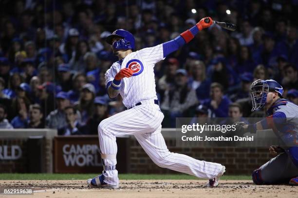 Javier Baez of the Chicago Cubs hits a home run in the second inning against the Los Angeles Dodgers during game four of the National League...