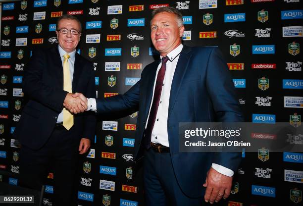 Garth Brennan shakes hands with CEO Graham Annesley after being announced as the new Gold Coast Titans NRL coach at Titans Centre of Excellence on...