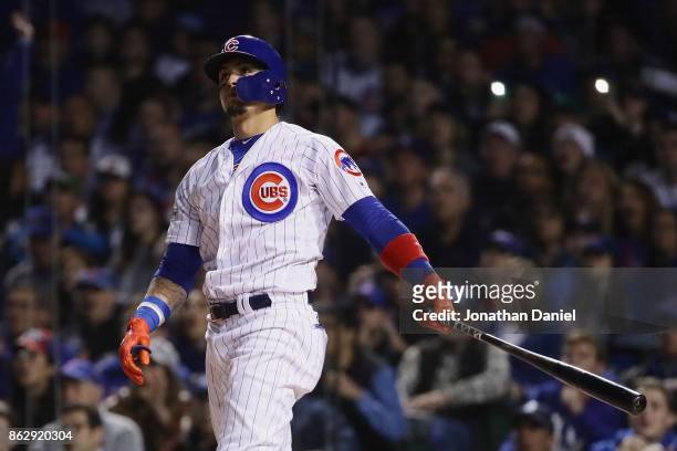 Javier Baez of the Chicago Cubs reacts to hitting a home run in the second inning against the Los Angeles Dodgers during game four of the National...