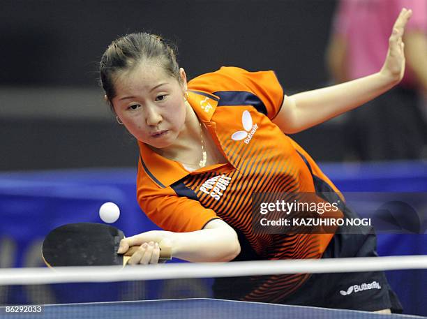 Li Jie of the Netherlands returns the ball to Ariel Hsing of the US during the women's singles first round match at the World Table Tennis...
