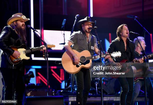 Honorees Chris Stapleton, Jason Aldean and Keith Urban perform onstage at the 2017 CMT Artists Of The Year on October 18, 2017 in Nashville,...