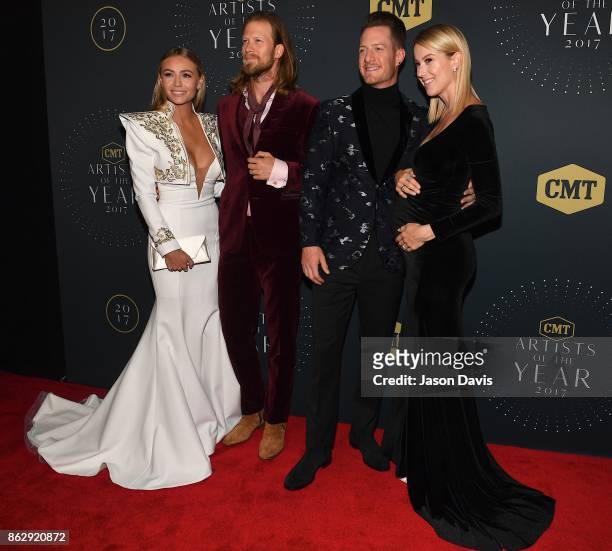 Recording Artists Brian Kelley and Tyler Hubbard of Florida Georgia Line arrive with their wives Brittany Cole and Hayley Stommel at the 2017 CMT...
