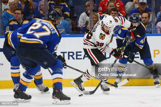 Ryan Hartman of the Chicago Blackhawks handles the puck against the St. Louis Blues in the second period at the Scottrade Center on October 18, 2017...