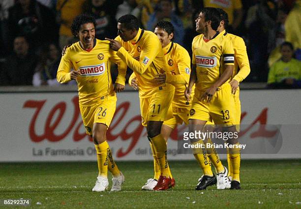 Juan Carlos Silva, Robert de Pinho, and Pavel Pardo of Club America celebrate Silva's goal during the first half at Toyota Park on April 29, 2009 in...