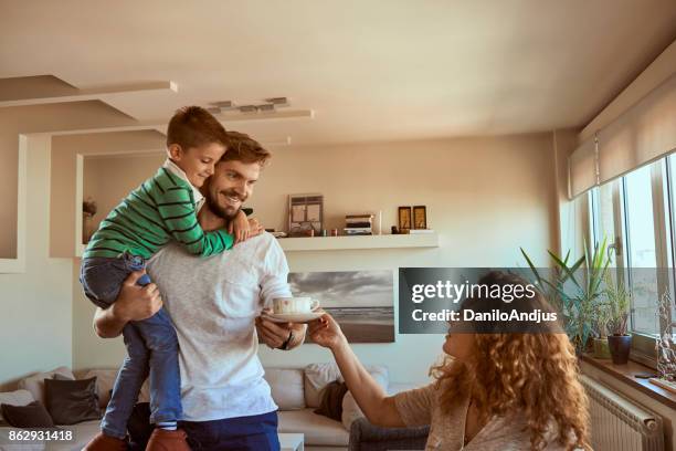 family at home - boy looking over shoulder stock pictures, royalty-free photos & images