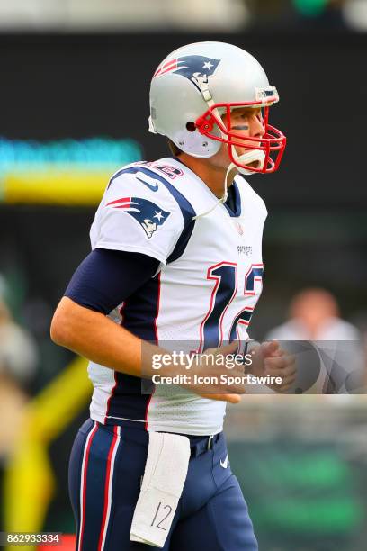 New England Patriots quarterback Tom Brady warms up prior to the National Football League game between the New York Jets and the New England Patriots...