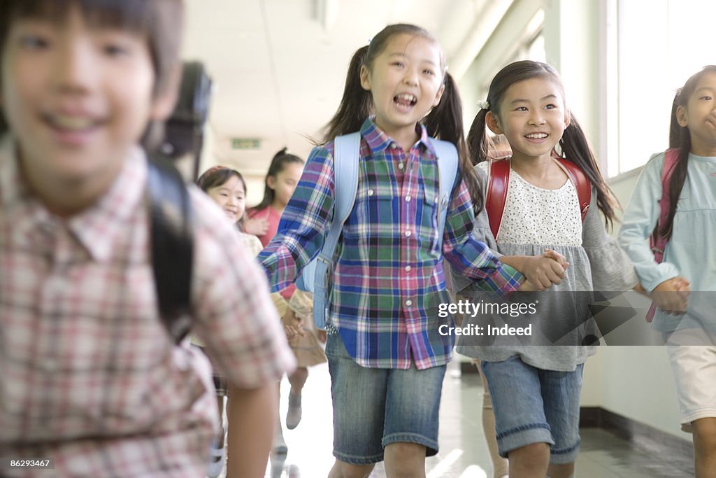 Japanese school children in corridor