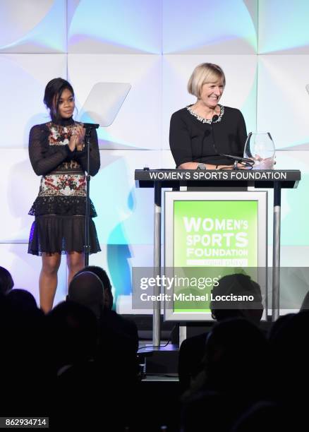 Mary Gen Ledecky accepts the Individual Sportswoman of the YearAward for daughter Katie Ledecky from Gabby Douglas during The Women's Sports...