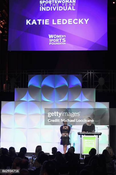 Mary Gen Ledecky accepts the Individual Sportswoman of the YearAward for daughter Katie Ledecky from Gabby Douglas during The Women's Sports...