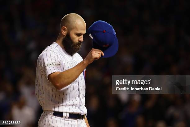 Jake Arrieta of the Chicago Cubs acknowledges the crowd after being relieved in the seventh inning against the Los Angeles Dodgers during game four...