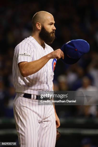 Jake Arrieta of the Chicago Cubs acknowledges the crowd after being relieved in the seventh inning against the Los Angeles Dodgers during game four...