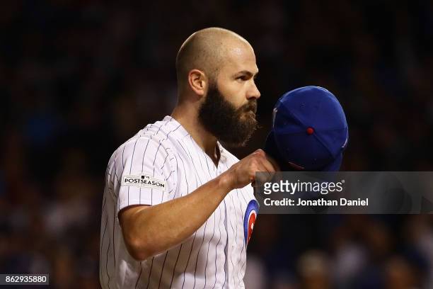 Jake Arrieta of the Chicago Cubs acknowledges the crowd after being relieved in the seventh inning against the Los Angeles Dodgers during game four...