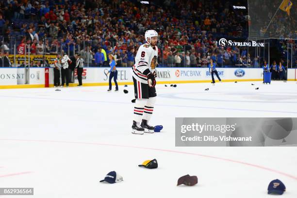 Michal Kempny of the Chicago Blackhawks leave the ice after Jaden Schwartz of the St. Louis Blues competed a hat trick with an empty-net goal against...