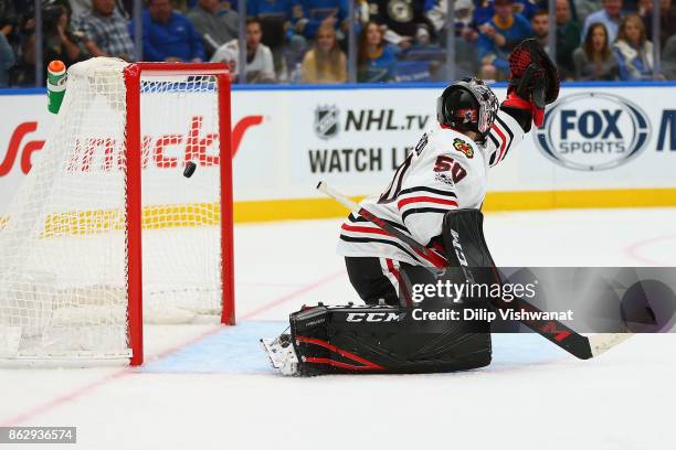 Corey Crawford of the Chicago Blackhawks allows a goal against the St. Louis Blues in the third period at the Scottrade Center on October 18, 2017 in...