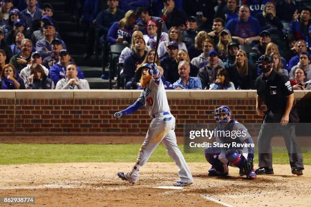Justin Turner of the Los Angeles Dodgers hits a home run in the eighth inning against the Chicago Cubs during game four of the National League...