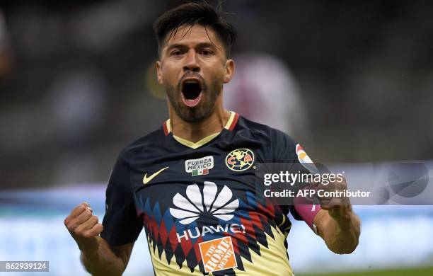 America's forward Oribe Peralta celebrates after scoring a goal against Guadalajara during their Mexican Apertura tournament football match at the...