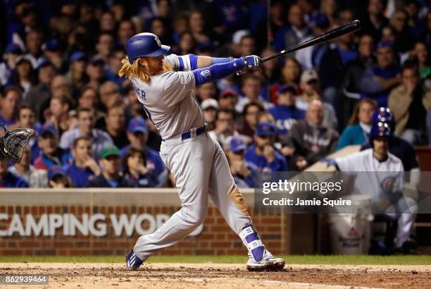 Justin Turner of the Los Angeles Dodgers hits a home run in the eighth inning against the Chicago Cubs during game four of the National League...