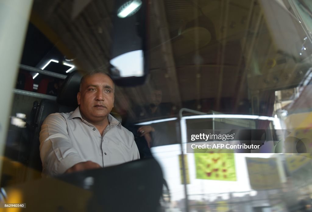 Pakistan Rafiullah Driver This photograph taken on October 8, 2017 shows Pakistani bus driver ...