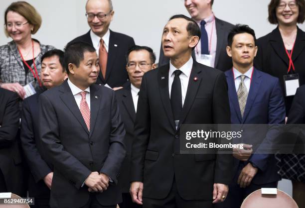 Ignasius Jonan, Indonesia's minister of energy and mineral resources, front left, and Anantaporn Kanjanarat, Thailands minister of energy, front...