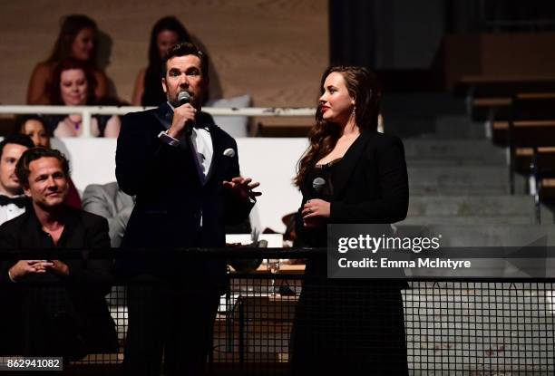 Patrick Brammall and Katherine Langford speak onstage at the 6th Annual Australians in Film Award & Benefit Dinner at NeueHouse Hollywood on October...