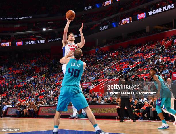 Jon Leuer of the Detroit Pistons shoots the ball against the Charlotte Hornets during the game on October 18, 2017 at Little Caesars Arena in...