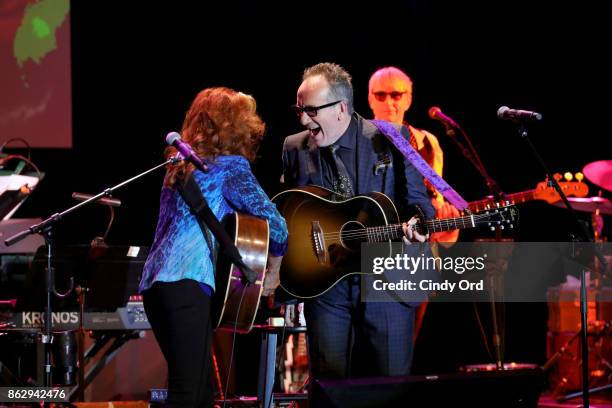 Bonnie Raitt and Elvis Costello perform onstage during the Little Kids Rock Benefit 2017 at PlayStation Theater on October 18, 2017 in New York City.