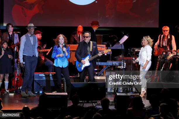 Keb' Mo', Bonnie Raitt, Elvis Costello, and Darlene Love perform onstage during the Little Kids Rock Benefit 2017 at PlayStation Theater on October...