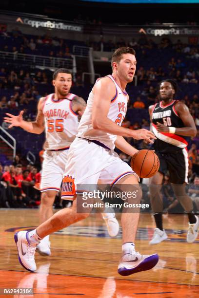 Alec Peters of the Phoenix Suns handles the ball against the Portland Trail Blazers on October 18, 2017 at Talking Stick Resort Arena in Phoenix,...