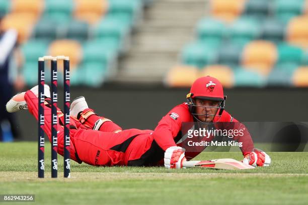 Alex Carey of the Redbacks slides in to avoid a runout during the JLT One Day Cup match between South Australia and Victoria at Blundstone Arena on...