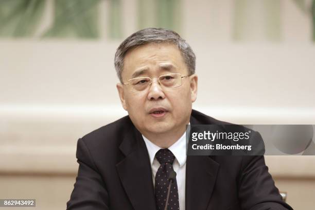 Guo Shuqing, chairman of the China Banking Regulatory Commission, speaks during a news conference at the Great Hall of the People during the 19th...