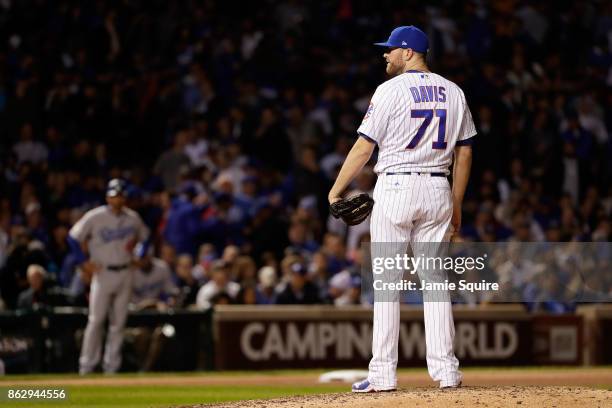 Wade Davis of the Chicago Cubs pitches in the ninth inning against the Los Angeles Dodgers during game four of the National League Championship...