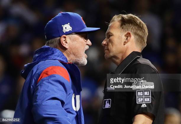 Manager Joe Maddon of the Chicago Cubs argues an overturned call with umpire Jim Wolf and is ejected in the eighth inning during game four of the...