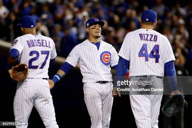 Addison Russell, Javier Baez, and Anthony Rizzo of the Chicago Cubs meet during a pitching change in the seventh inning against the Los Angeles...