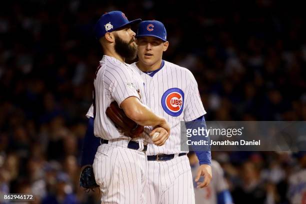 Anthony Rizzo of the Chicago Cubs meets with Jake Arrieta in the seventh inning against the Los Angeles Dodgers during game four of the National...