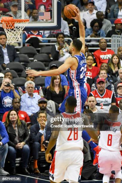 Philadelphia 76ers guard Ben Simmons scores in the first half against Washington Wizards center Ian Mahinmi on October 18, 2017 at the Capital One...