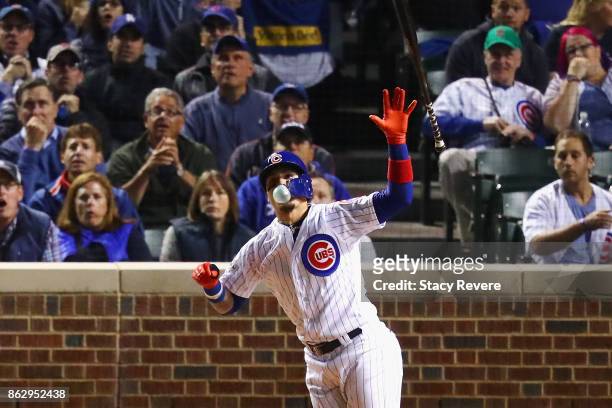 Javier Baez of the Chicago Cubs reacts to hitting a home run in the fifth inning against the Los Angeles Dodgers during game four of the National...