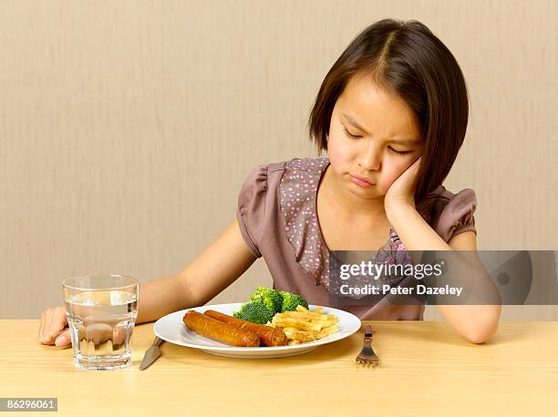 determined girl refusing to eat. - picky eater stock pictures, royalty-free photos & images