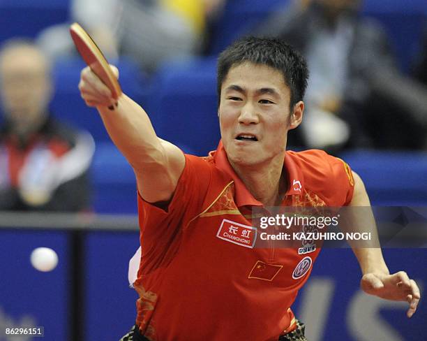 China's Wang Ligin returns the ball against Japan's Kenji Matsudaira during their men's singles second round match in the World Table Tennis...