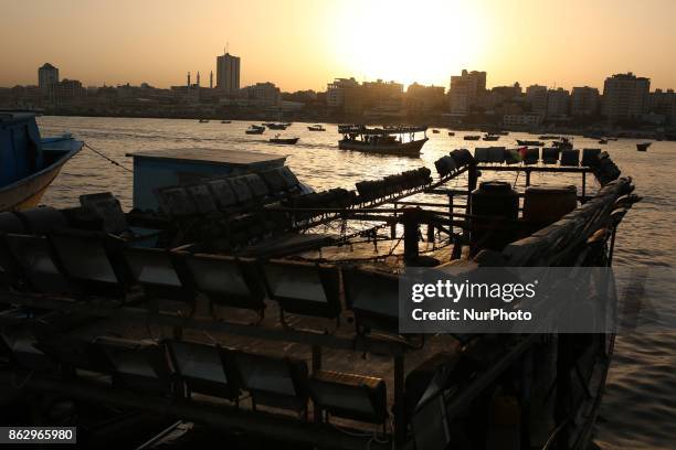 Palestinian fishermen set off for the sea in Gaza City on October 19, 2017 on the first day that fishermen will be allowed by Israel to travel up to...