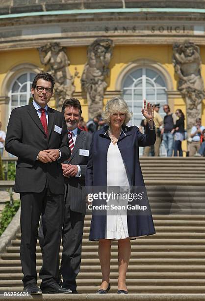 Camilla, Duchess of Cornwall, accompanied by Hartmut Dorgerloh , Director of the Foundation of Prussian Palaces and Gardens, and Jann Jakobs, Mayor...