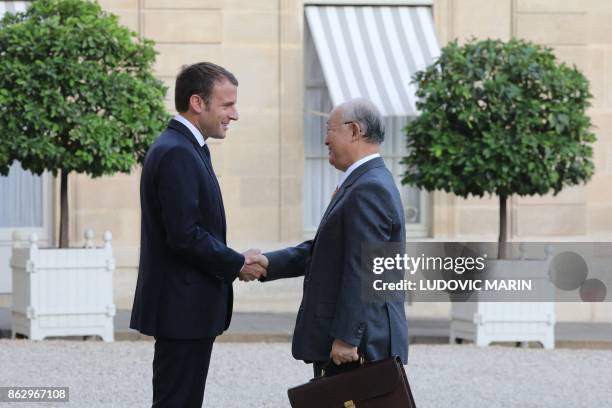 French president Emmanuel Macron welcomes Director General of the International Atomic Energy Agency , Yukiya Amano at the Elysee palace in Paris on...